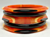 SZ20 Shultz 5 pc orange, black & cream bakelite bangle set